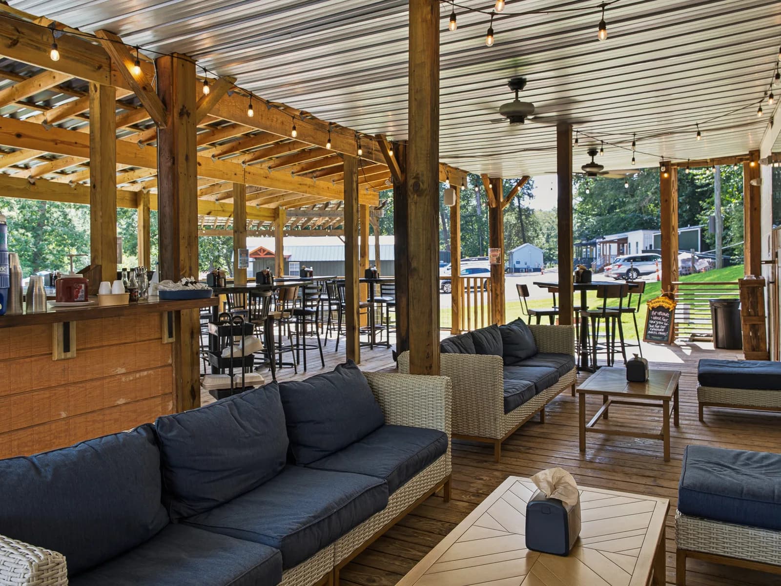 Picnic tables and outdoor seating by the river